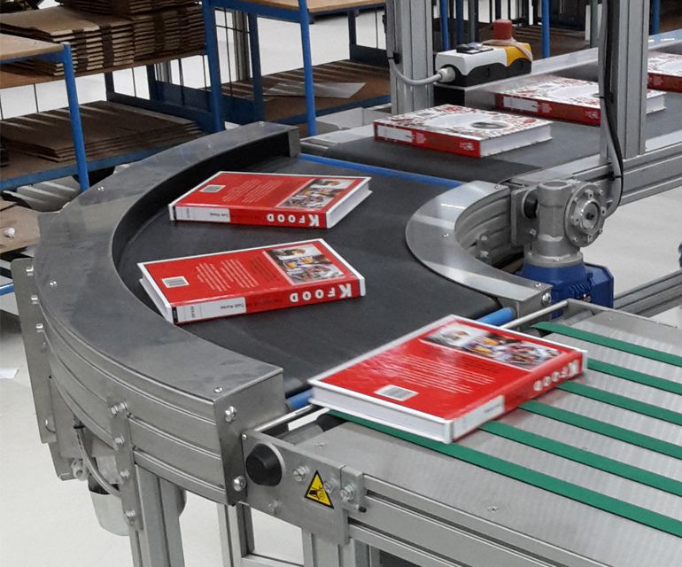 Curved belt conveyor in the printing industry