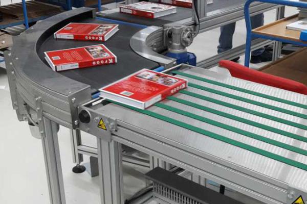 Transport of books with round bend Type KDC