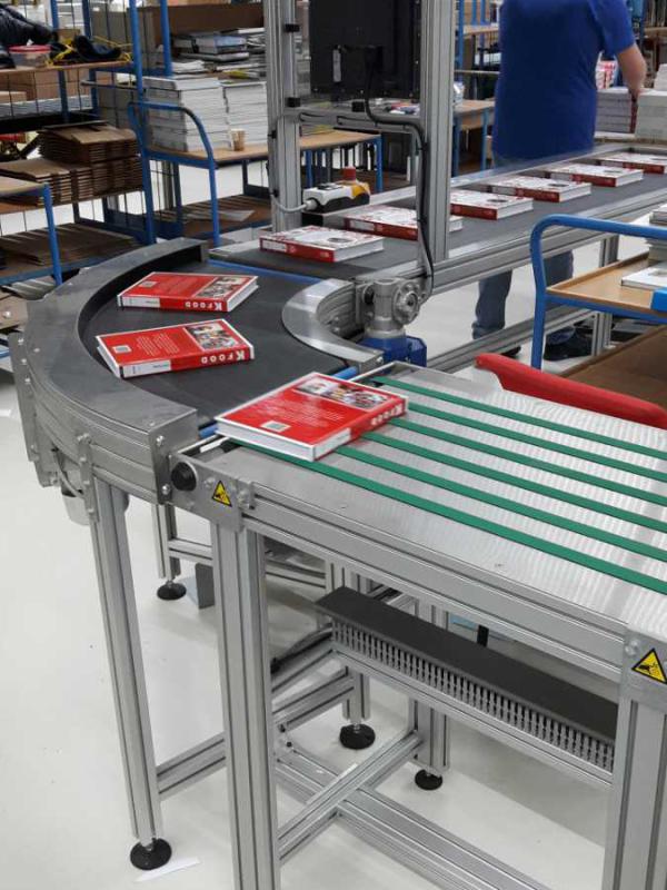 Transport of books with round bend Type KDC